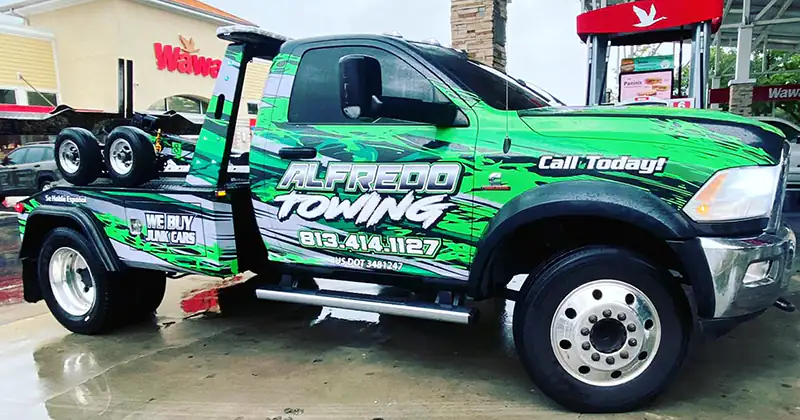 Image show a tow truck of Alfredo Towing Services. It is considered the face of the company