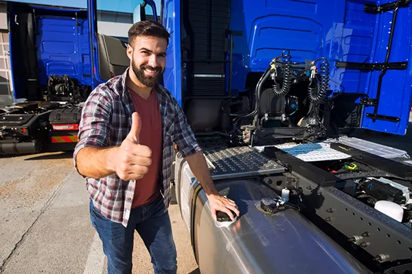 towing roadside assistance truck-driver-opening-reservoir-tank-refuel-truck-holding-thumbs-up towing roadside assistance truck driver opening reservoir tank refuel