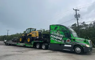 Semi truck Transporting a construction equipment