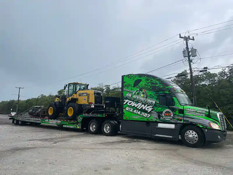 Semi truck Transporting a construction equipment