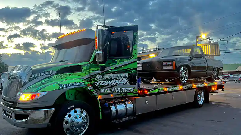 Flatbed with a red car up