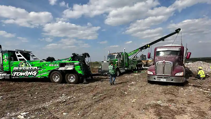 A tow truck rotator on action performing a recovery service in Tampa