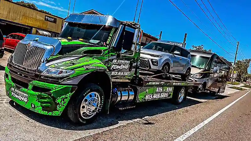 flatbed with two cars